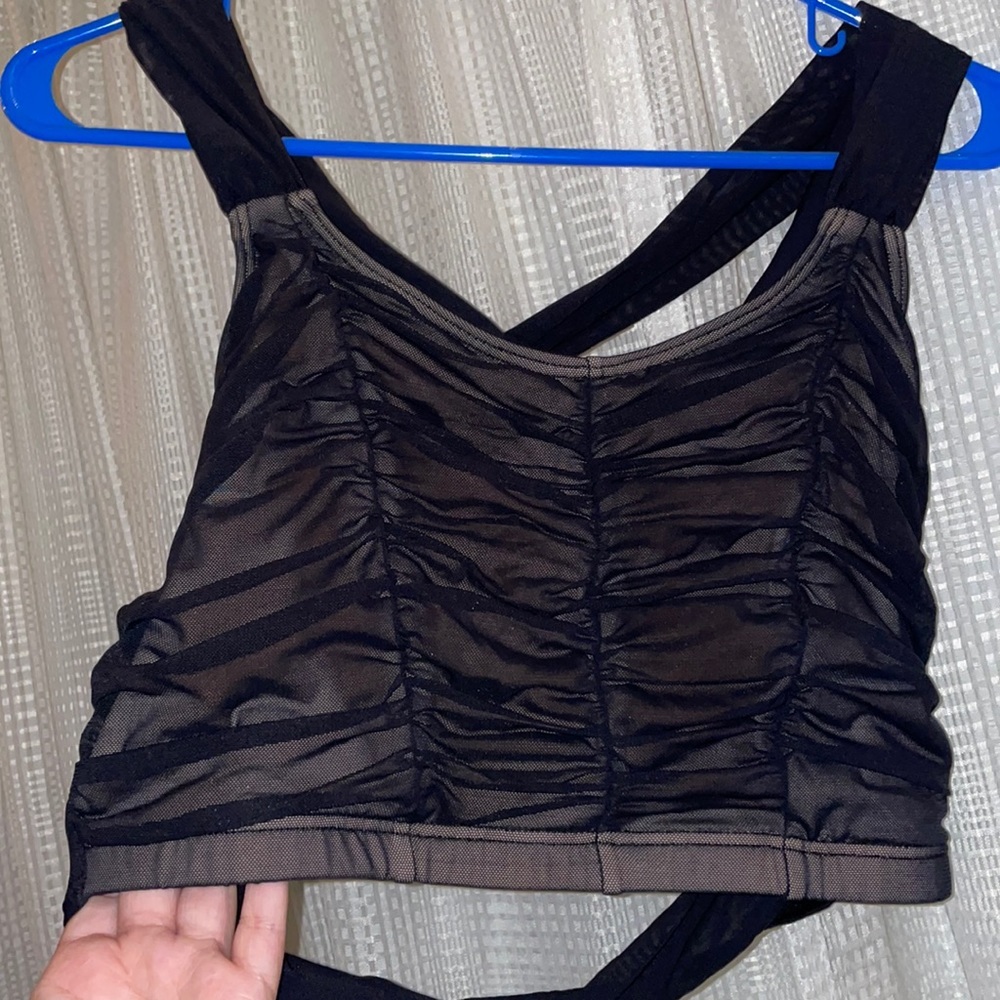 Black ruched mesh sports bra. Criss cross of mesh straps on back.